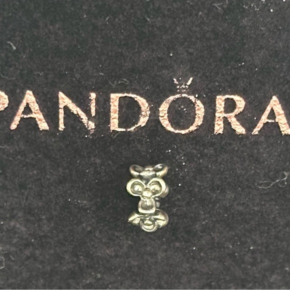 Pandora Jewelry - Pandora Sterling silver charm with bow like design.